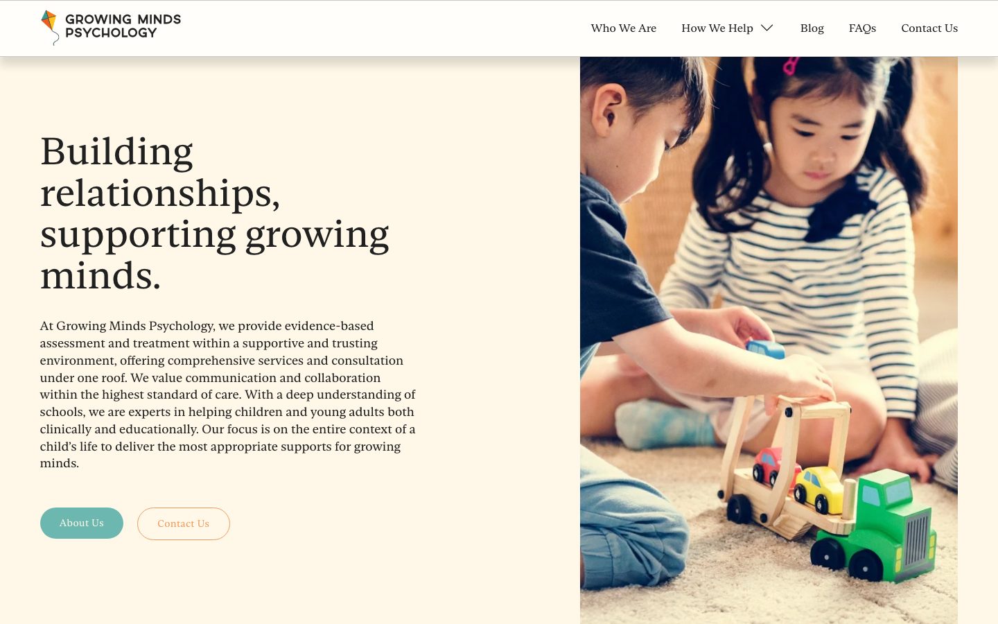 The Growing Minds Psychology homepage, a child playing with toy trucks beside the headline "Building relationships, supporting growing minds."