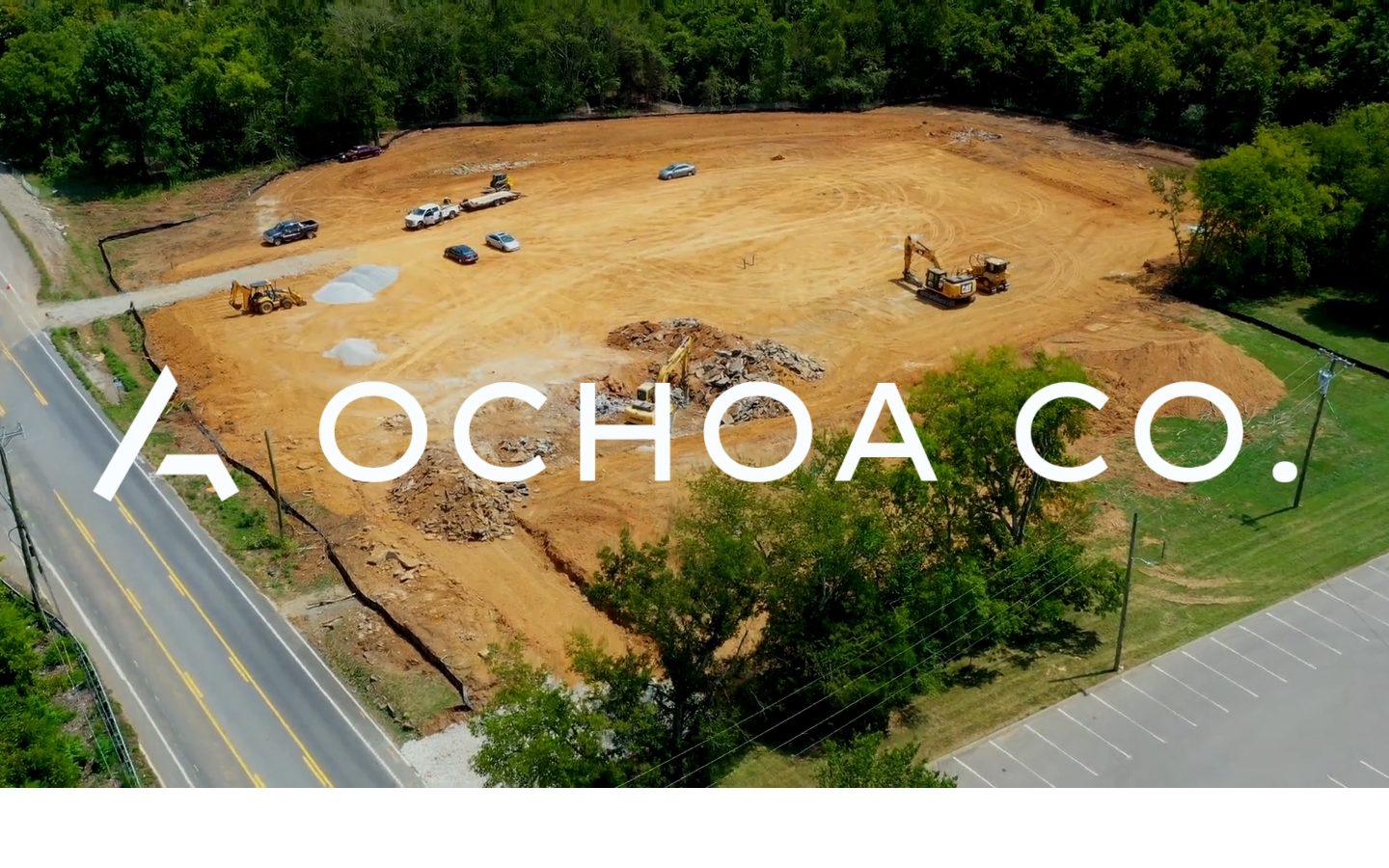 The Ochoa Co. homepage, the company wordmark over an aerial photo of a job site being cleared.